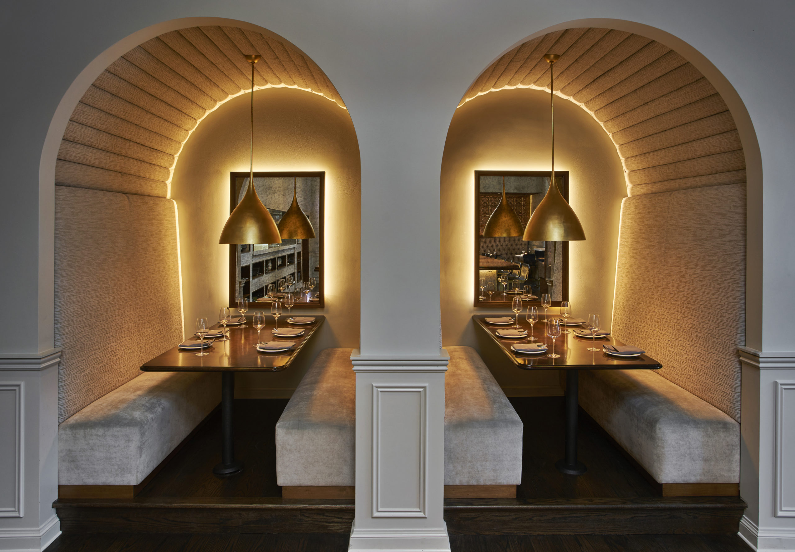 architectural lighting design in arches over dining tables