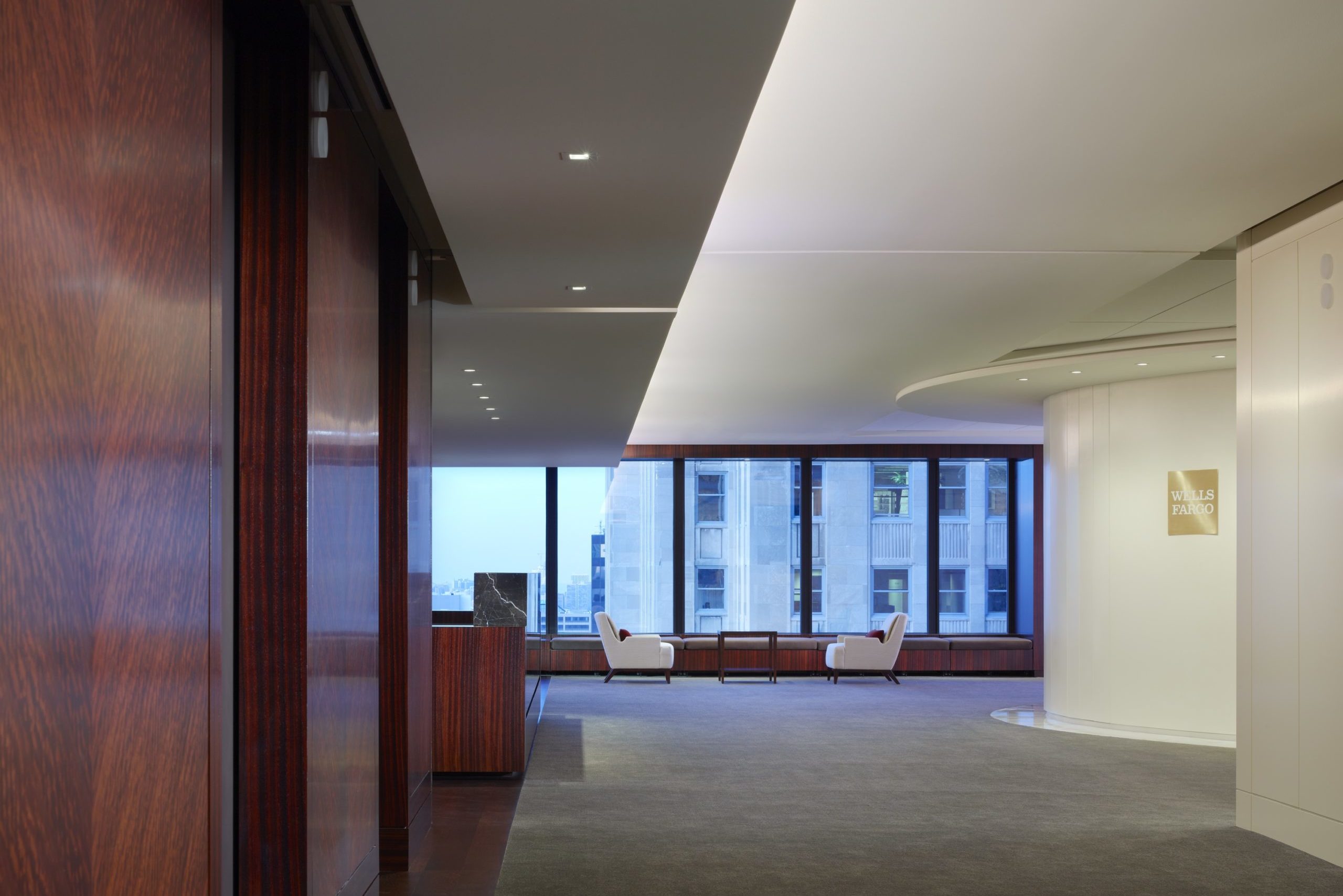 open concept office building with chairs project lighting design
